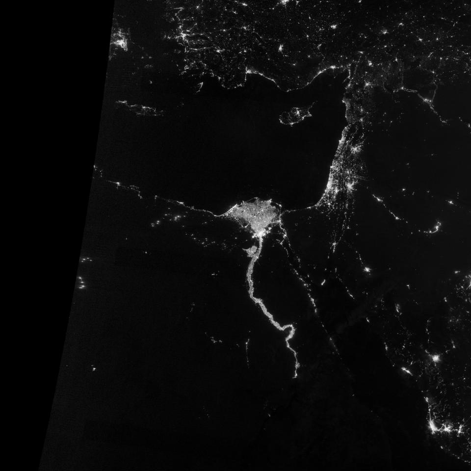 On October 13, 2012, the Visible Infrared Imaging Radiometer Suite (VIIRS) on the Suomi NPP satellite captured this nighttime view of the Nile River Valley and Delta. This image is from the VIIRS “day-night band,” which detects light in a range of wavelengths from green to near-infrared and uses filtering techniques to observe signals such as gas flares, auroras, wildfires, city lights, and reflected moonlight. (NASA)