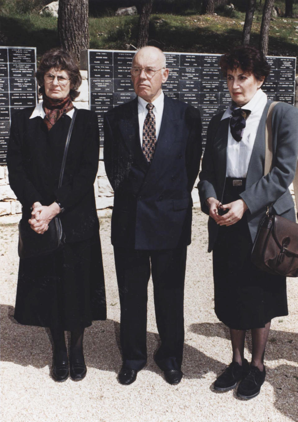 Andrzej Sitkowski, center, attends with Marion Kozak Miliband, left, and Hadassah Kozak, right, a ceremony in Yad Vashem, Jerusalem, Feb. 19, 1996. Andrzej Sitkowski was 15 years old when his mother told him that she had been asked by a neighbour to hide the little Jewish girl Hadassah Kosak from the Nazis at their home. This year, as the world commemorates the 77th anniversary of the liberation of the German Nazi Auschwitz concentration and extermination camp on January 27, 1945, Yad Vashem and the Conference on Jewish Material Claims against Germany have teamed up to highlight the stories of "Righteous Rescuers" the people who risked everything, even their own lives, to save Jews from getting murdered by the Nazis and their henchmen.( Yad Vashem via AP)