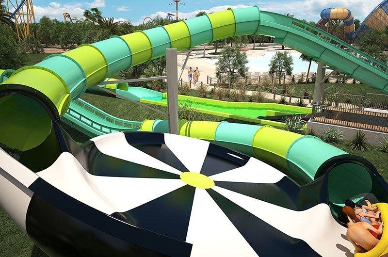 Guests ride the Thunder Rapids waterslide at Six Flags Fiesta Texas. The ride is part of the Hurricane Harbor water park add-on.