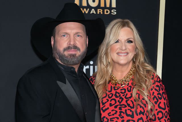 <p>SUZANNE CORDEIRO/AFP via Getty Images</p> Garth Brooks and Trisha Yearwood