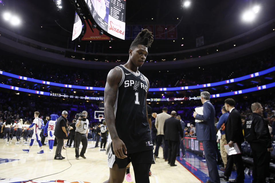 San Antonio Spurs' Lonnie Walker IV walks off the court after the team's NBA basketball game against the Philadelphia 76ers, Friday, Nov. 22, 2019, in Philadelphia. Philadelphia won 115-104. (AP Photo/Matt Slocum)