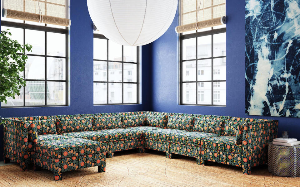 A sectional in Laranya in Multi and ​ottoman in Aalap in blue by John Robshaw for Cloth & Company 