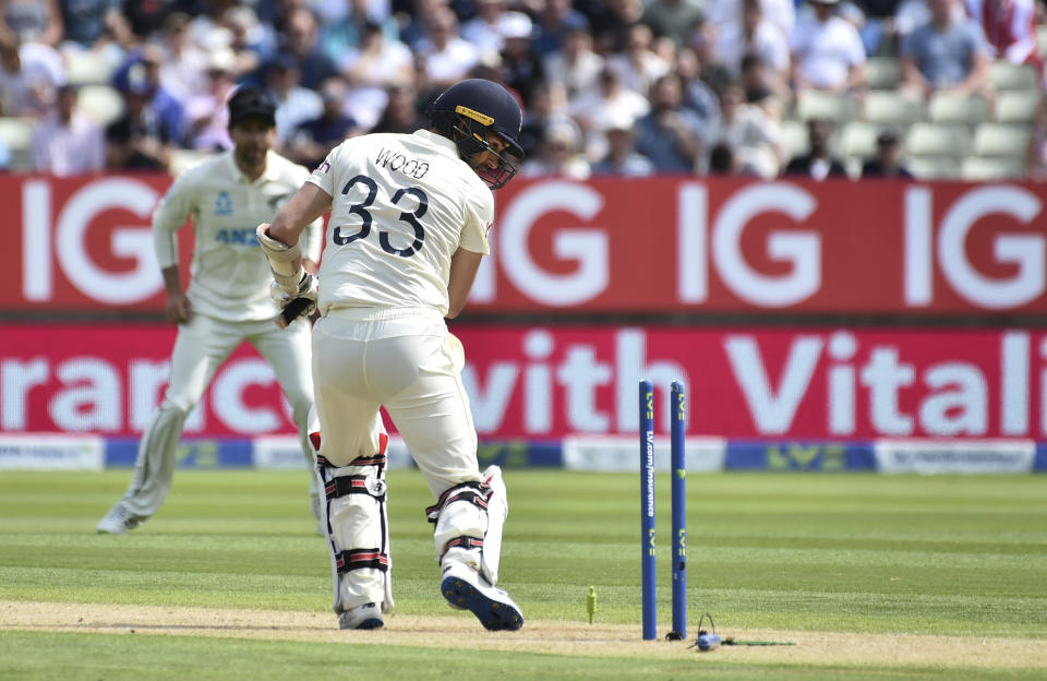 England's Mark Wood is bowled out by New Zealand's Matt Henry during the second day of the second cricket test match between England and New Zealand at Edgbaston in Birmingham, England, Friday, June 11, 2021. (AP Photo/Rui Vieira)