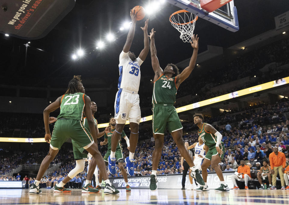 Creighton's Fredrick King (33) shoots against Florida A&M's Miles Hall (23) and Ja'Derryus Eatmon (24) during the first half of an NCAA college basketball game on Tuesday, Nov. 7, 2023, in Omaha, Neb. (AP Photo/Rebecca S. Gratz)