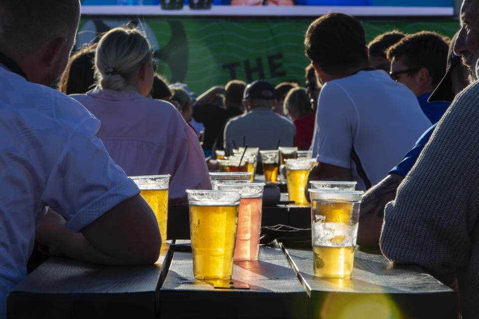 People enjoying a few drinks during the Euro 2020 semi final match between England and Denmark on the 7th of July 2021 at the outdoor screen at Folkestone Harbour Arm, in Folkestone, United Kingdom. (photo by Andrew Aitchison / In pictures via Getty Images)