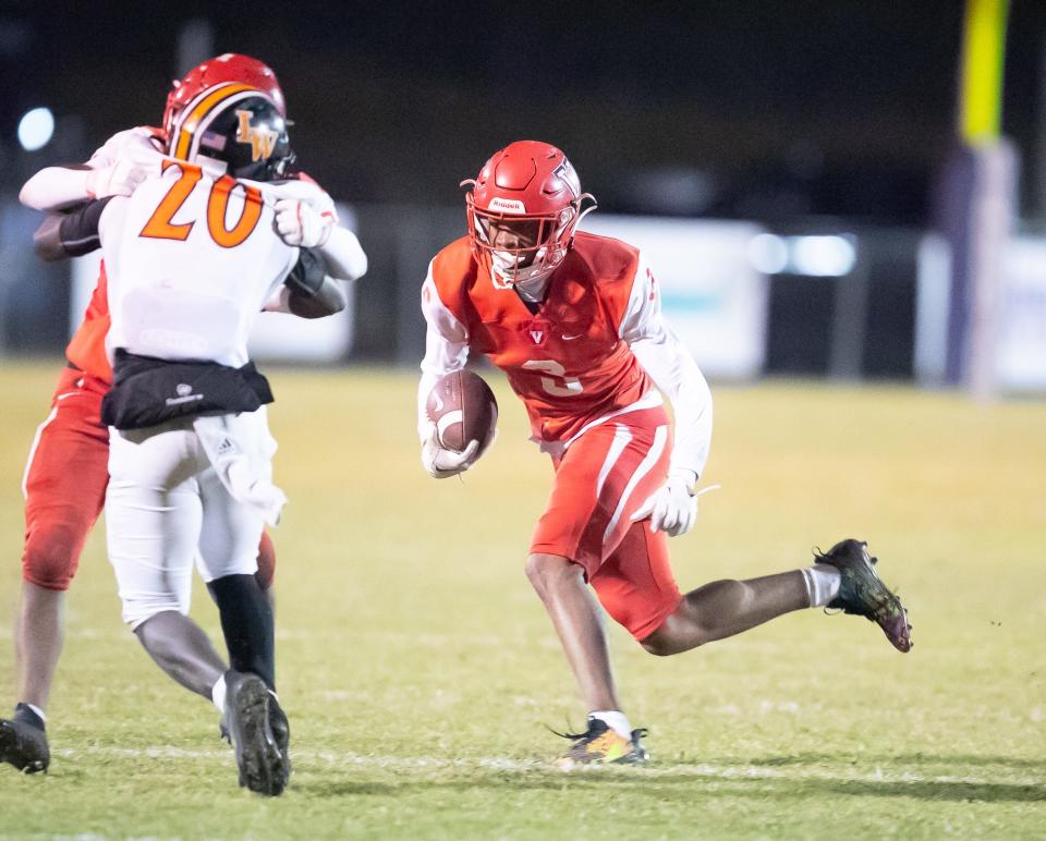 Vanguard Cam'ron King (3) makes yards as Vanguard High School takes on Lake Wales during a play off game in the 2023 FHSAA Football State Championship at Booster Stadium in Ocala, FL on Friday, November 24, 2023. [Alan Youngblood/Ocala Star-Banner]