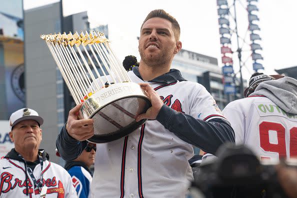 ATLANTA, GA - NOVEMBER 05: Freddie Freeman holds the Commissioner's Trophy as members of the Atlanta Braves celebrate following their World Series Parade at Truist Park on November 5, 2021 in Atlanta, Georgia. The Atlanta Braves won the World Series in six games against the Houston Astros winning their first championship since 1995. (Photo by Megan Varner/Getty Images)