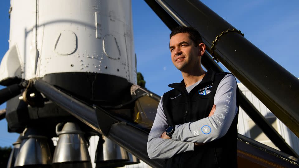 Jared Isaacman, founder and chief executive officer of Shift4 Payments, stands for a portrait in front of the recovered first stage of a Falcon 9 rocket at SpaceX's headquarters in Hawthorne, California on February 2, 2021. - Patrick T. Fallon/AFP/Getty Images