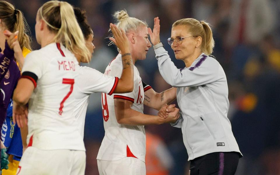 New coach Sarina Wiegman celebrates the win with her players - ACTION IMAGES