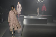 Models wear creations for the Fendi fall winter 22/23 collection, in Milan, Italy, Saturday, Jan. 15, 2022. (AP Photo/Antonio Calanni)