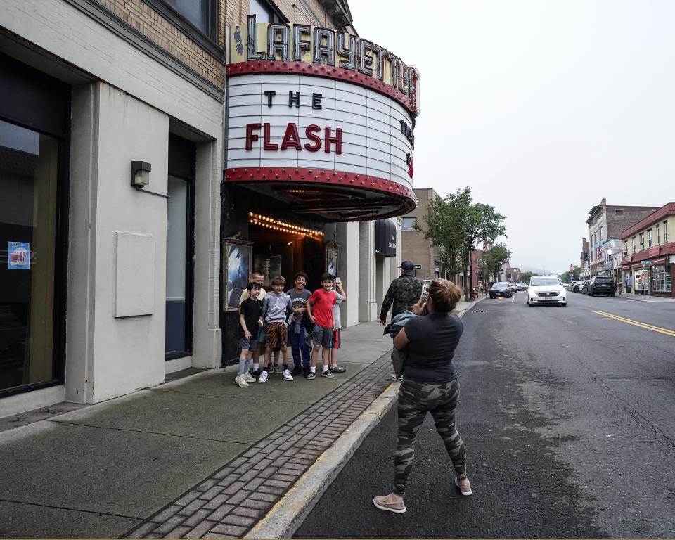 Lita Barron of Oakland, N.J. takes a picture of kids under the marque of the Lafayette Theater in Suffern on Friday, June 23, 2023.The Lafayette Theater opened its doors in 1924 showing silent movies, and in 1953 was the first theater to have CinemaScope to show wide screen movies.The Lafayette is currently a modern example of a single-screen neighborhood theater and remains a popular landmark of Rockland County. While continuing to run first-run films every day, the Lafayette also runs alternative programming to keep up with changing tastes in entertainment.