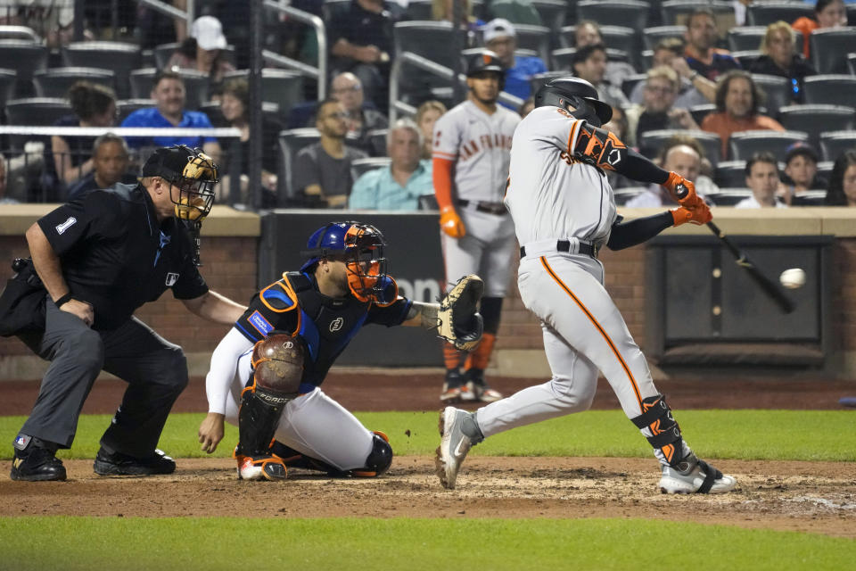 San Francisco Giants' Patrick Bailey, right, hits a three-run home run during the eighth inning of a baseball game against the New York Mets, Friday, June 30, 2023, in New York. (AP Photo/Mary Altaffer)