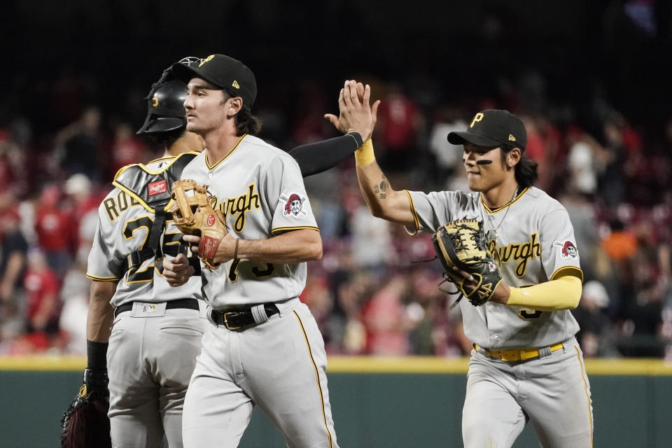 Pittsburgh Pirates' Ji Hwan Bae, right, celebrates with catcher Endy Rodriguez, left, after the team's 13-12 victory against the Cincinnati Reds in a baseball game Saturday, Sept. 23, 2023, in Cincinnati. (AP Photo/Joshua A. Bickel)