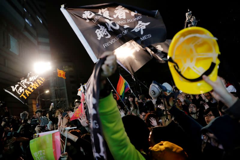 FILE PHOTO: Hong Kong anti-government protesters attend a rally in support of Taiwan President Tsai Ing-wen outside the Democratic Progressive Party (DPP) headquarters in Taipei