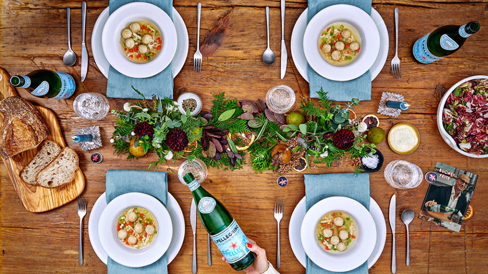A holiday table featuring Stanley Tucci's Chicken Soup with Tiny Chicken Meatballs