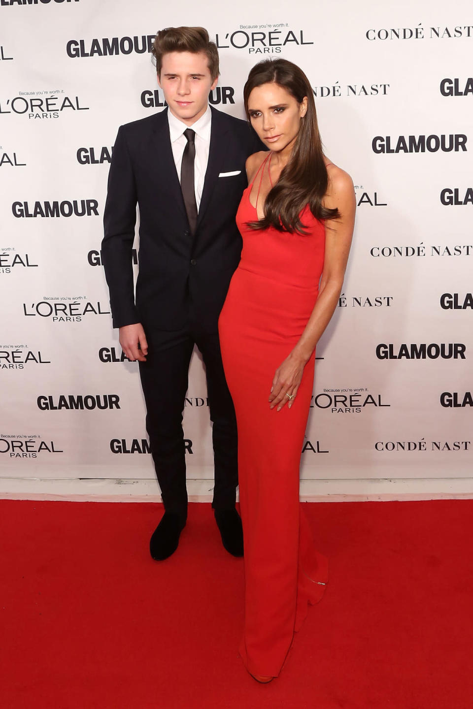 Victoria Beckham in a dress of her own design with her son Brooklyn at the 2015 Glamour Women Of The Year Awards.