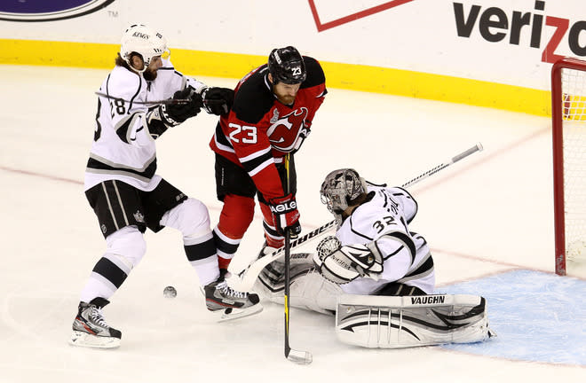  Jarret Stoll #28 Of The Los Angeles Kings And David Clarkson #23 Of The New Jersey Devils Fight For A Loose Puck In  Getty Images