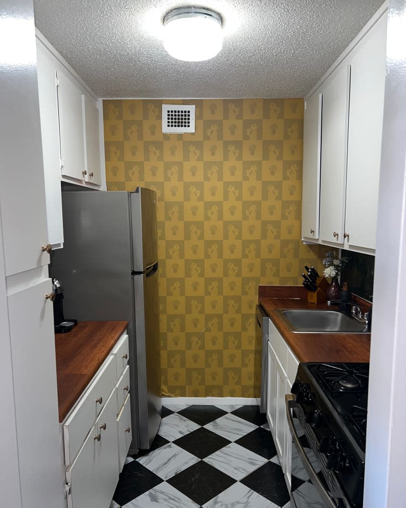 Yellow checker peel and stick wallpaper in kitchen.