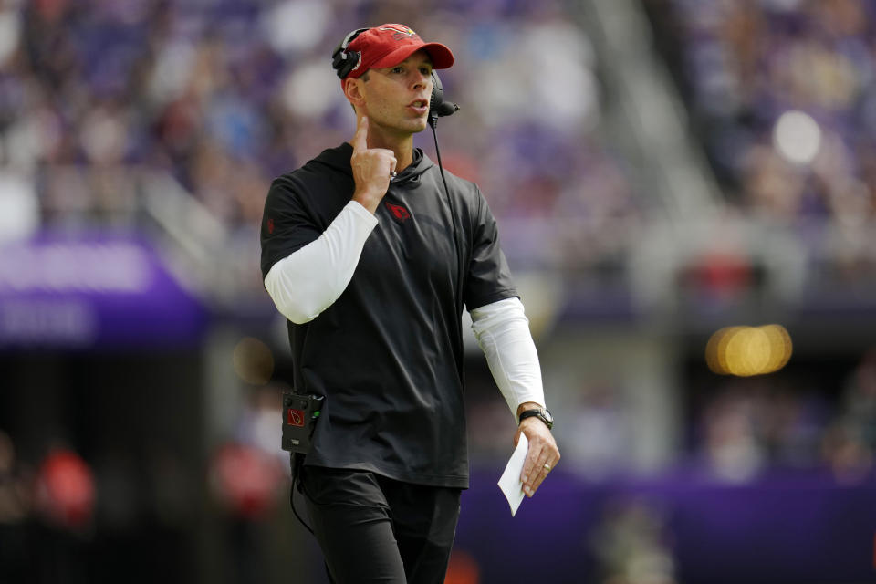 Arizona Cardinals head coah Jonathan Gannon makes a call during the first half of an NFL preseason football game against the Minnesota Vikings, Saturday, Aug. 26, 2023, in Minneapolis. (AP Photo/Abbie Parr)