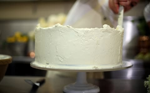 Claire Ptak puts finishing touches on the cake - Credit: Hannah McKay