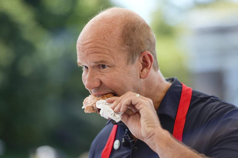 Former Rep. John Delaney (D-Md.) opts for a pork chop at the state fair on Aug. 9.