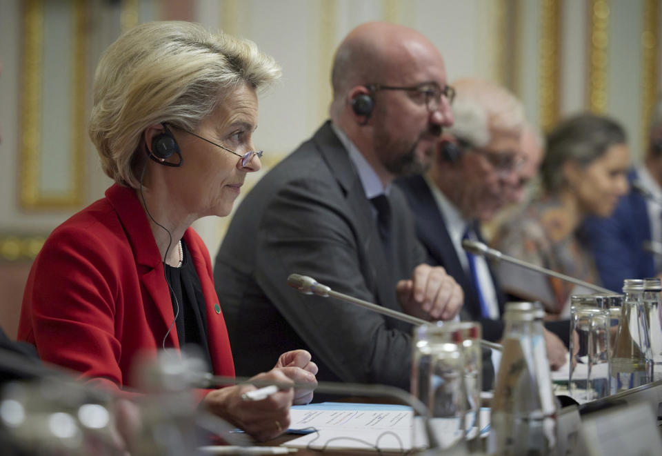 European Commission President Ursula von der Leyen, left, listens during a Ukraine EU summit in Kyiv, Ukraine, Tuesday, Oct. 12, 2021. The 23rd summit between the European Union and Ukraine is held in Kyiv. (Ukrainian Presidential Press Office via AP)