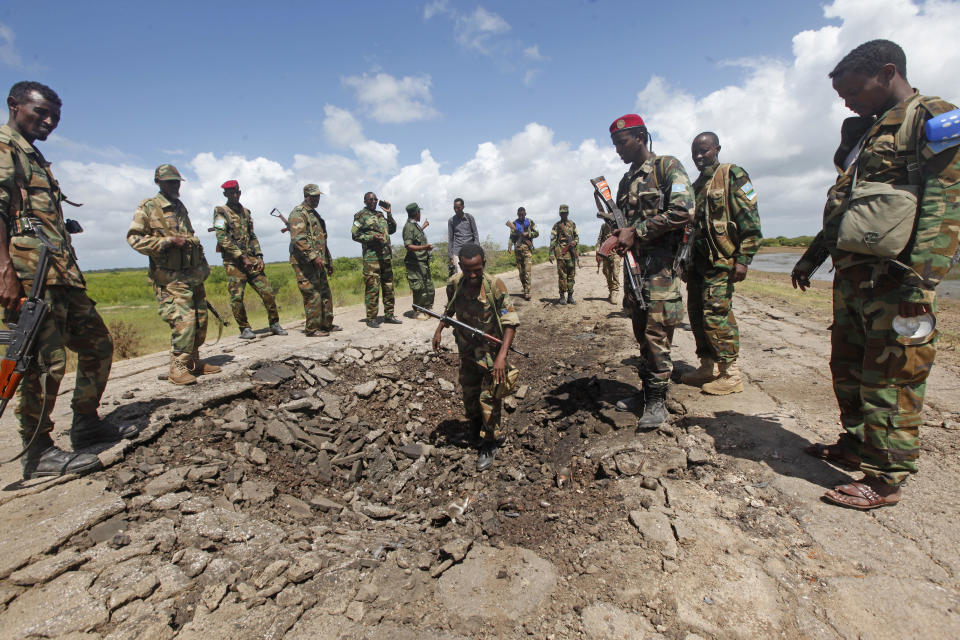 In this Wednesday, June 13, 2018 file photo, Somali soldiers stand at a Somali military base, near the site of an attack by al Shabab in which a US soldier was killed and four others were injured in Somalia.  / Credit: Farah Abdi Warsameh / AP