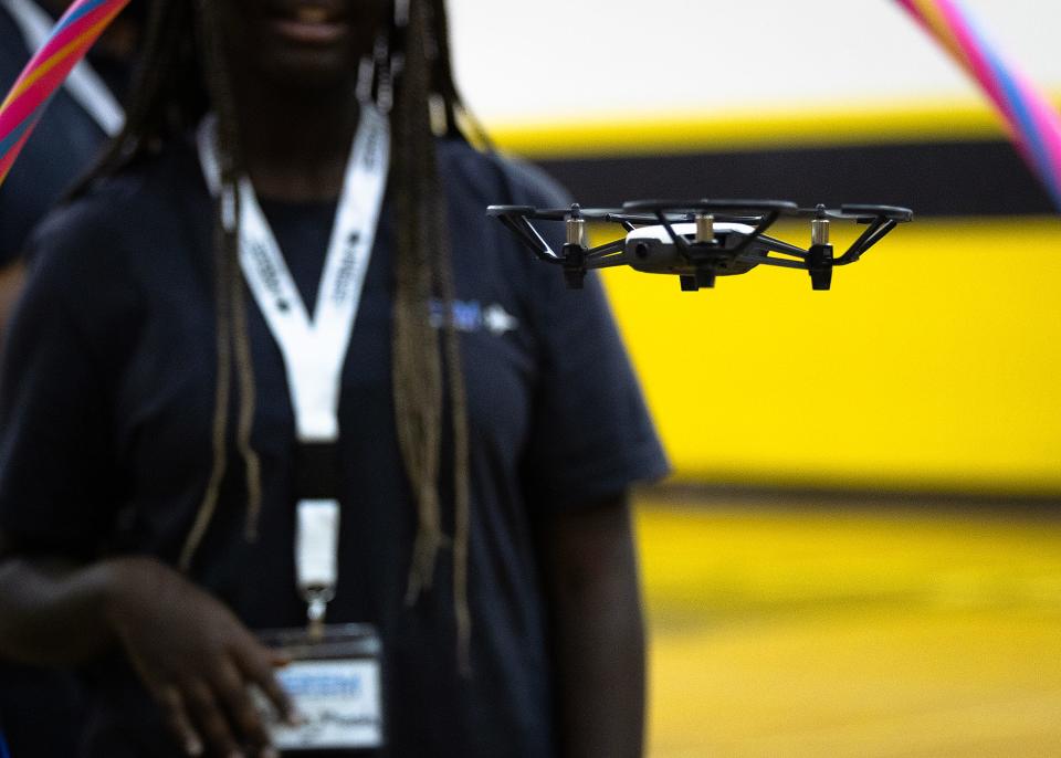 Bay County students fly a drone through a STEM Mavericks’ robotics obstacle course at Rutherford High School July 25, 2024. The three one-week sessions were hosted by Florida State University Panama City’s engineering program with funding from Trenchant Analytics, and the Chief Digital and Artificial Intelligence Office in the Department of Defense. (Tyler Orsburn/News Herald)