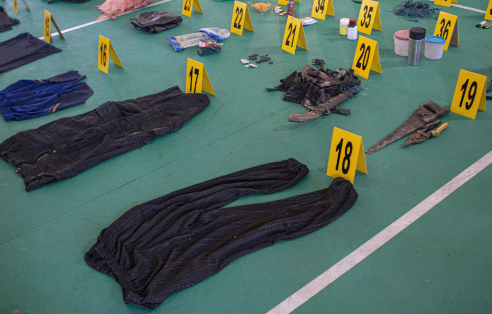 Evidence items which belonged to suspected militants, Ali Kalora and Jaka Ramadan, are seen during a press conference at the Parigi Moutong Police Station in Parigi Moutong district, Central Sulawesi, Indonesia, Sunday, Sept. 19, 2021. Indonesia's most wanted militant with ties to the Islamic State group was killed Saturday in a shootout with security forces, the Indonesian military said, in a sweeping counterterrorism campaign against extremists in the remote mountain jungles. (AP Photo/Mohammad Taufan)