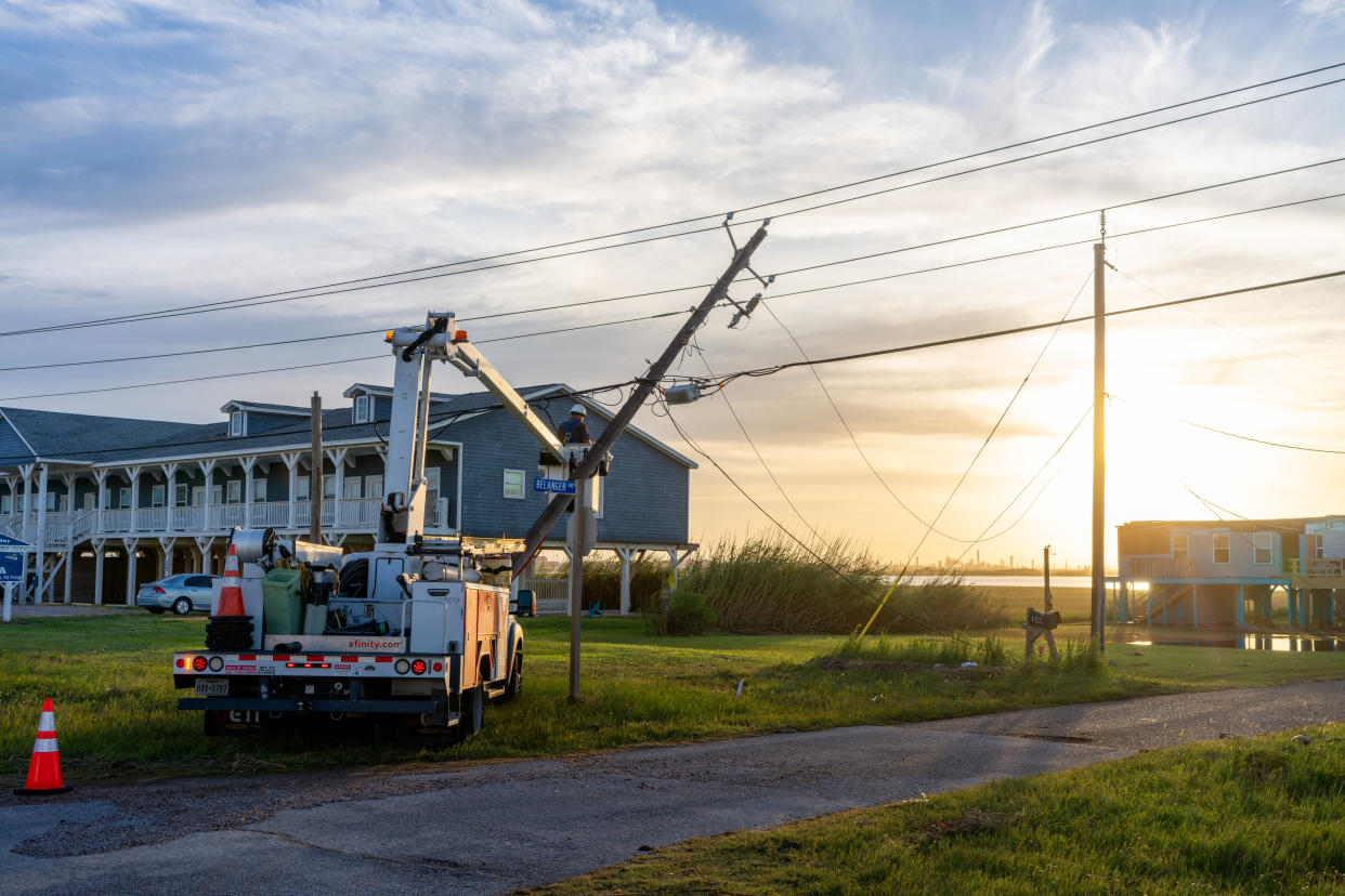 SURFSIDE BEACH, TEXAS - JULY 08: A utility worker works to restore a damaged power-line after Hurricane Beryl swept through the area on July 08, 2024 in Surfside, Texas. Tropical Storm Beryl developed into a Category 1 hurricane as it hit the Texas coast late last night.  (Photo by Brandon Bell/Getty Images)