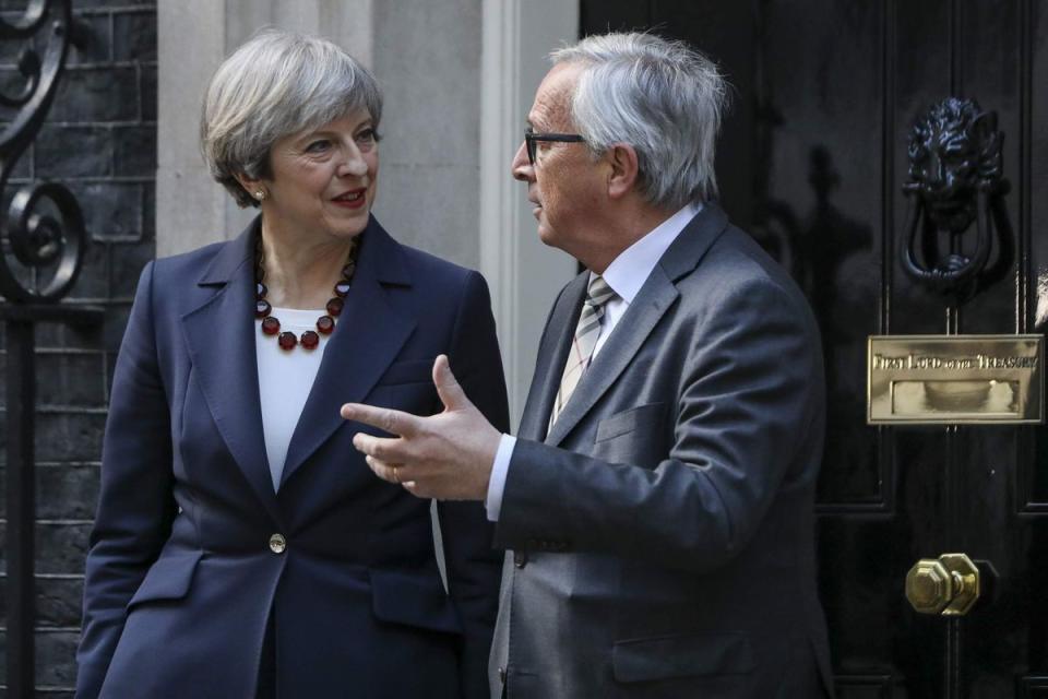 Theresa May has told Jean-Claude Juncker the UK will pay all it owes up until 2020 (Chris Ratcliffe/Bloomberg via Getty Images)