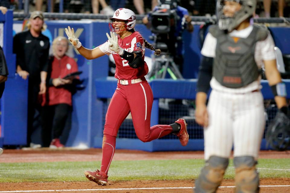 Oklahoma's Tiare Jennings (23) celebrates after hitting a three-run home run in the third inning of a championship series softball game in the Women's College World Series between the University of Oklahoma Sooners (OU) and the Texas Longhorns at USA Softball Hall of Fame Stadium in Oklahoma City, Wednesday, June 8, 2022. Oklahoma won 16-1. 