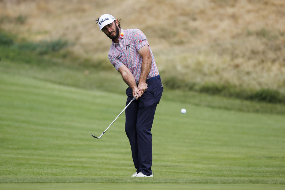 Max Homa chips onto the fifth green during the third round of the Genesis Invitational golf tournament at Riviera Country Club, Saturday, Feb. 18, 2023, in the Pacific Palisades area of Los Angeles. (AP Photo/Ryan Kang)