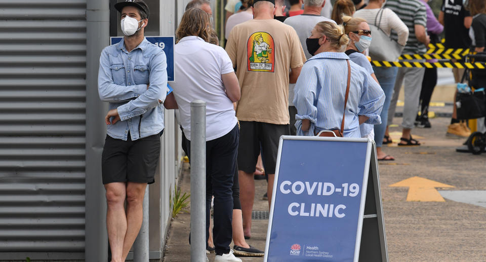 A large crowd lines up at a Covid-19 testing clinic. 