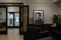 A portrait of Nikola Tesla is seen at Tesla BioHealing's Tesla Wellness Hotel and MedBed Center lobby on Tuesday, Nov. 14, 2023, in Butler, Pa. Like the automotive company, Tesla BioHealing is named for Nikola Tesla, the 19th century inventor, and early electrical pioneer whose eccentric life has made him a favorite of many conspiracy theorists. (AP Photo/Carolyn Kaster)