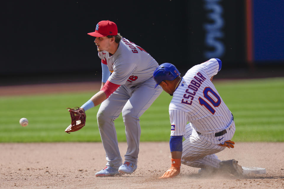 New York Mets' Eduardo Escobar (10), right, steals second while St. Louis Cardinals second baseman Nolan Gorman waits for the ball during the sixth inning of a baseball game at Citi Field, Sunday, June 18, 2023, in New York. (AP Photo/Seth Wenig)