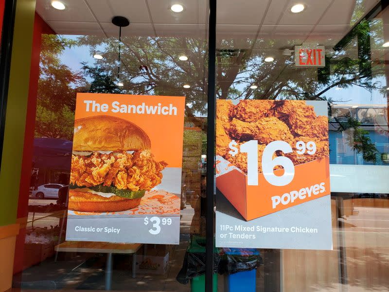 Signs advertising menu items are seen at fast food restaurants in New York City