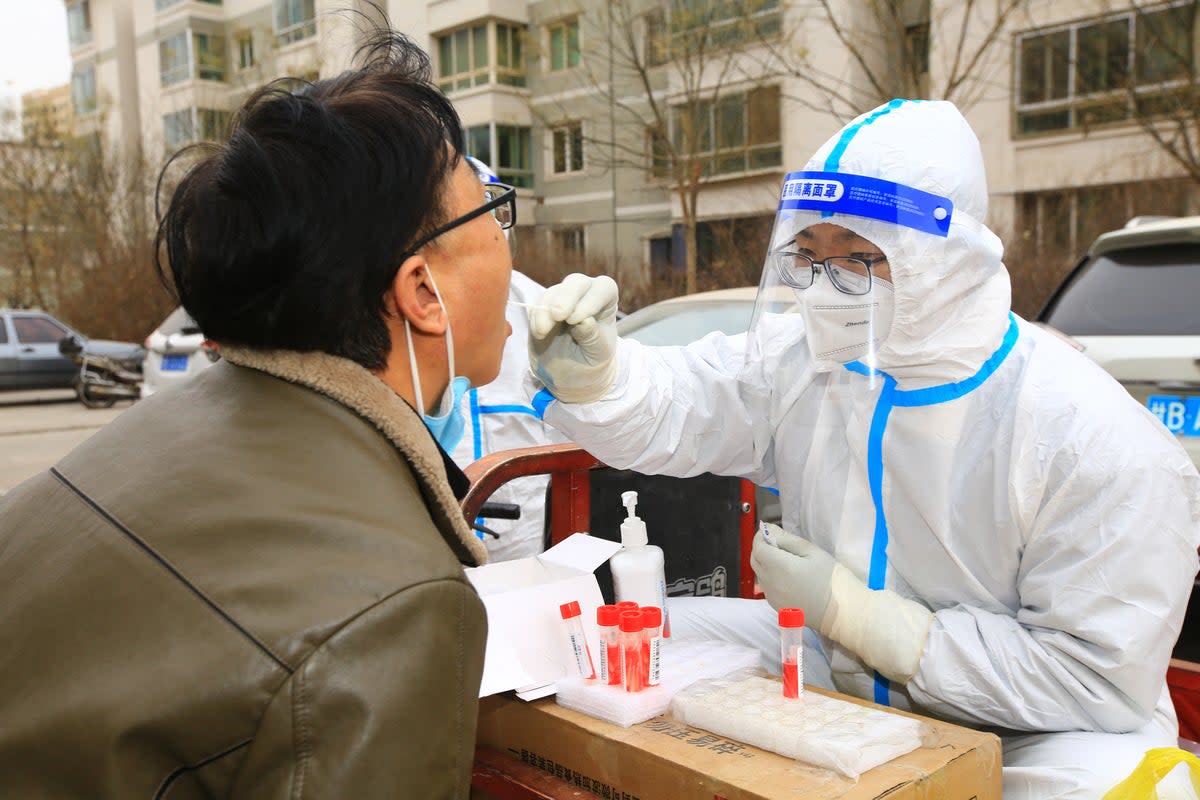 On November 24, China’s National Health Commission said more than 31,000 new cases had been reported in the past 24 hours (AFP via Getty Images)