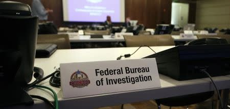 Phone banks dedicated to the Federal Bureau of Investigation are shown during a tour of the Multi-Agency Communications Center (MACC) at an undisclosed location in the Chicago suburbs May 17, 2012. REUTERS/Frank Polich