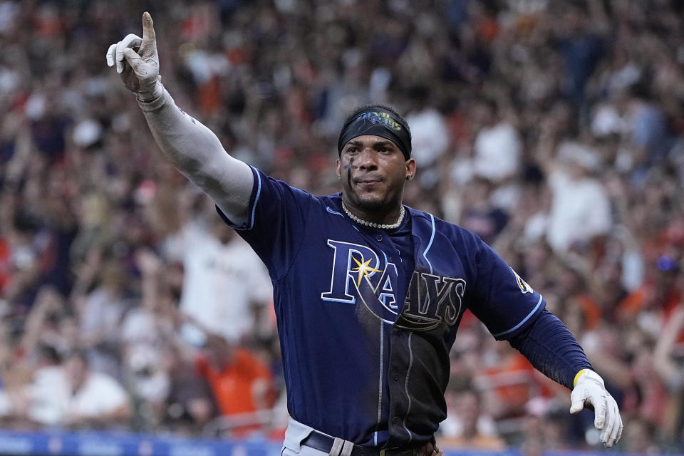 Tampa Bay Rays' Wander Franco gestures for the team to call for a replay review after he was tagged out at the plate during the first inning of the team's baseball game against the Houston Astros, Saturday, July 29, 2023, in Houston. The call was upheld.(AP Photo/Kevin M. Cox)