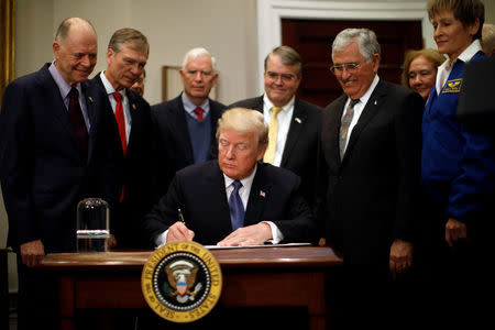 U.S. President Donald Trump participates in a signing ceremony for Space Policy Directive at the White House in Washington D.C., U.S. December 11, 2017. REUTERS/Carlos Barria