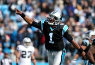 Cam Newton #1 of the Carolina Panthers celebrates after throwing a touchdown pass to teammate Steve Smith #89 during their game against the Oakland Raiders at Bank of America Stadium on December 23, 2012 in Charlotte, North Carolina. (Photo by Streeter Lecka/Getty Images)