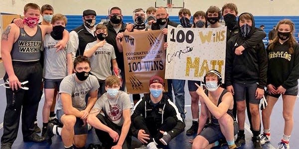 Western Wayne's Matt Leslie celebrating the 100th win of his varsity wrestling career.