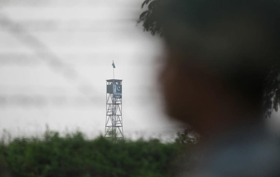 <p>An Indian Border Security Force soldier stands guard beside a fence at the India-Pakistan border area, as a Pakistani Rangers post is seen on the other side of the border at Ranbir Singh Pura, about 35 kilometers (22 miles) from Jammu, India, Sept. 24, 2016. Prime Minister Narendra Modi said in a speech Saturday that in the last four months, Indian security forces have killed more than 100 terrorists who crossed over the cease-fire line in Kashmir from Pakistani territory. (Photo: Channi Anand/AP)</p>