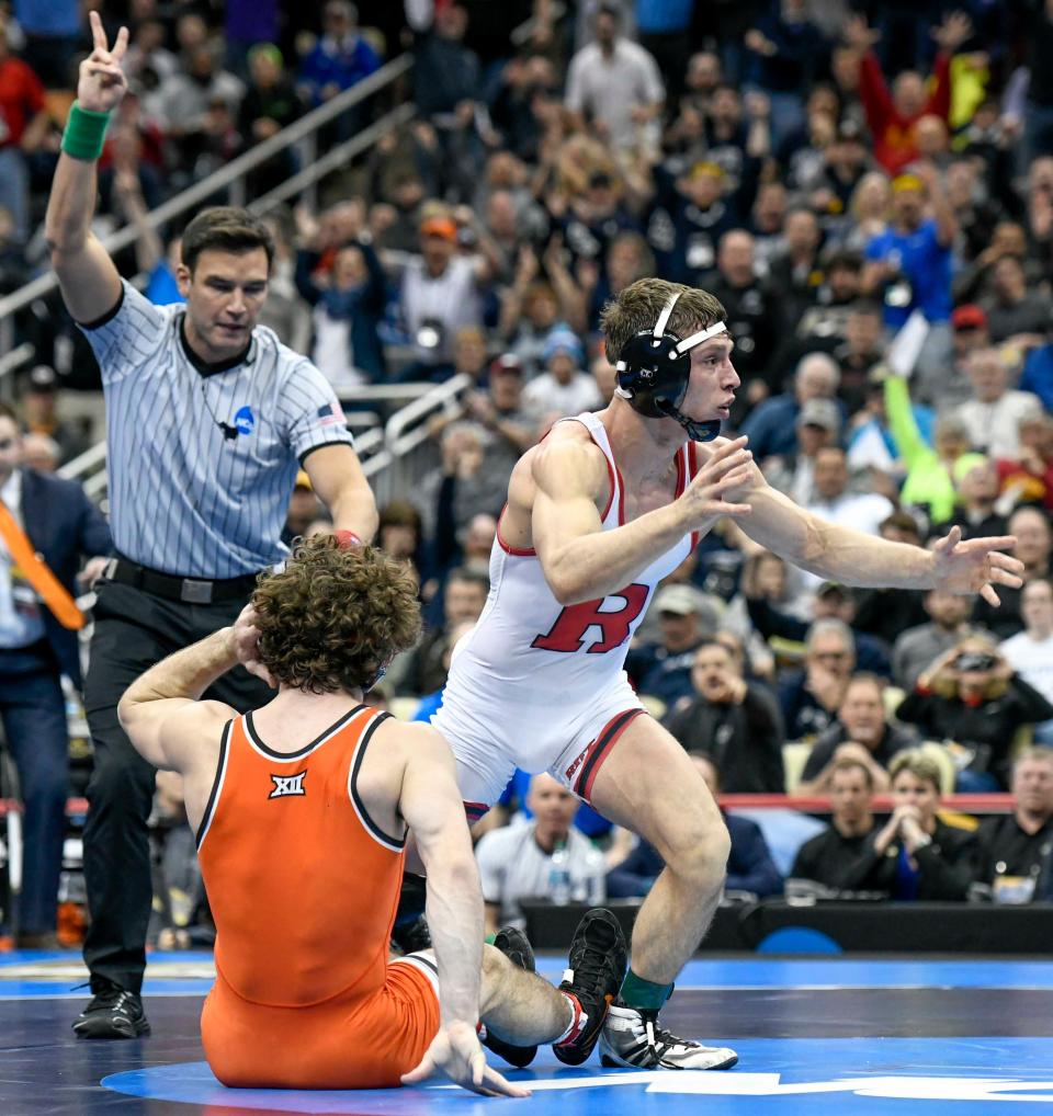 Nick Suriano, shown after he became Rutgers' first wrestling national champion by winning the NCAA 133-pound championship on March 23, 2019 at PPG Arena, Pittsburgh, is now wrestling for Michigan.