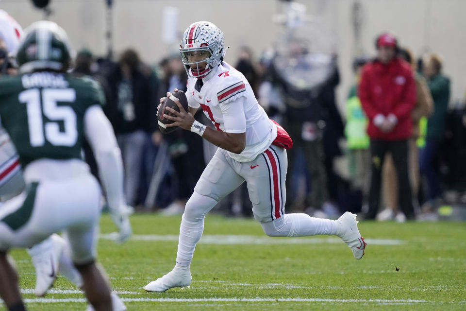 Ohio State quarterback C.J. Stroud looks downfield during the first half of an NCAA college football game against Michigan State, Saturday, Oct. 8, 2022, in East Lansing, Mich. (AP Photo/Carlos Osorio)