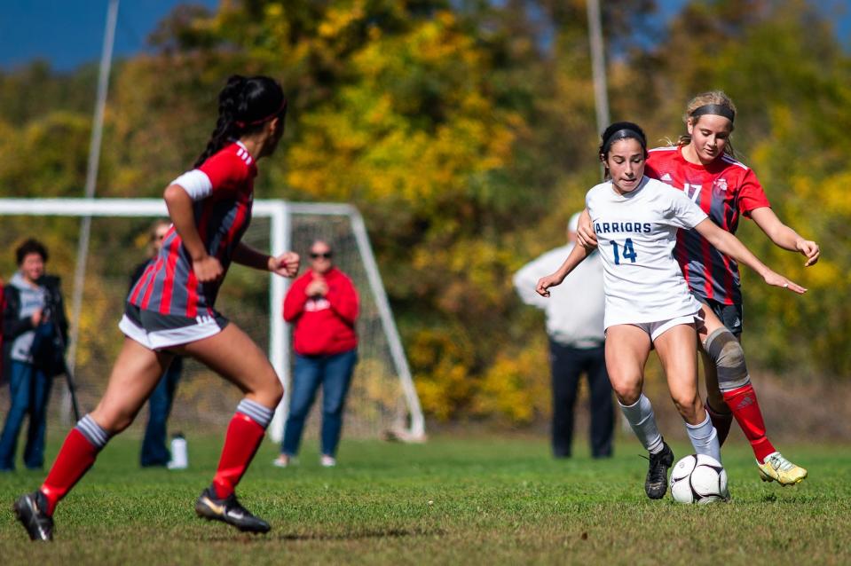 Red Hook's Molly Button, back, holds, Loudes' Julia Gigliotti as she goes to kick the ball during a Section 9 soccer game at Red Hook High School in Red Hook, NY on Saturday, October 15, 2022. KELLY MARSH/FOR THE POUGHKEEPSIE JOURNAL