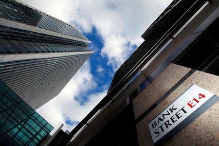 A sign for Bank Street and high rise offices are seen in the financial district in Canary Wharf in London, Britain, October 21, 2010. REUTERS/Luke Macgregor/File Photo