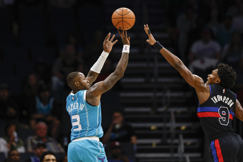 Charlotte Hornets guard Terry Rozier (3) shoots over Detroit Pistons forward Ausar Thompson (9) during the first quarter of an NBA basketball game in Charlotte, N.C., Friday, Oct. 27, 2023. (AP Photo/Nell Redmond)