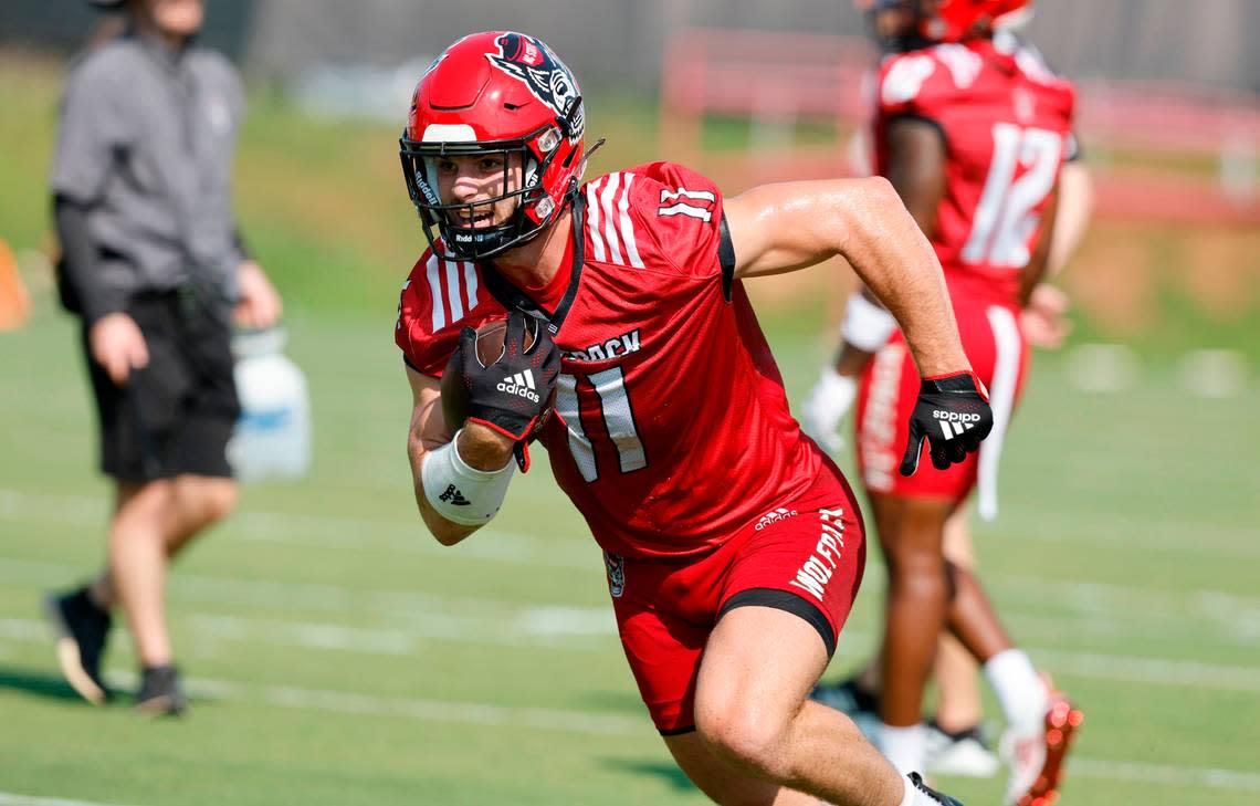 N.C. State linebacker Payton Wilson (11) runs upfield while running a drill during the Wolfpack’s first practice of fall camp in Raleigh, N.C., Wednesday, August 3, 2022.